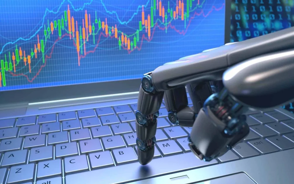 a robot hand touching a keyboard while trading stocks. Best AI Stock Trading Bots 2024 || Fintechloom